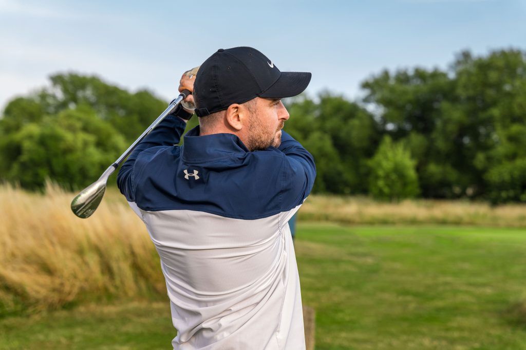Male playing golf