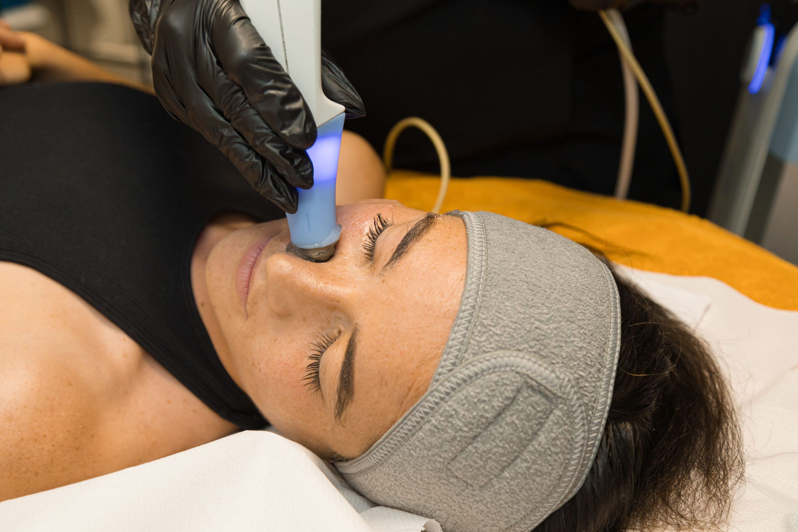 Female receiving facial treatment