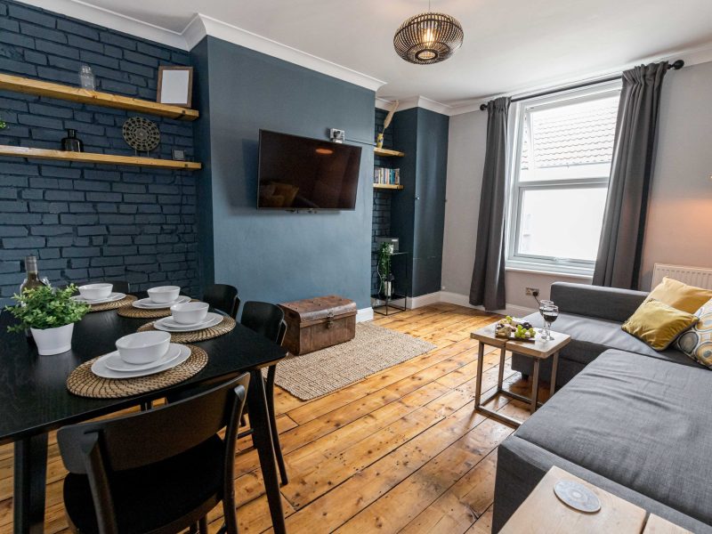 Spacious lounge in luxury apartment with dining room table